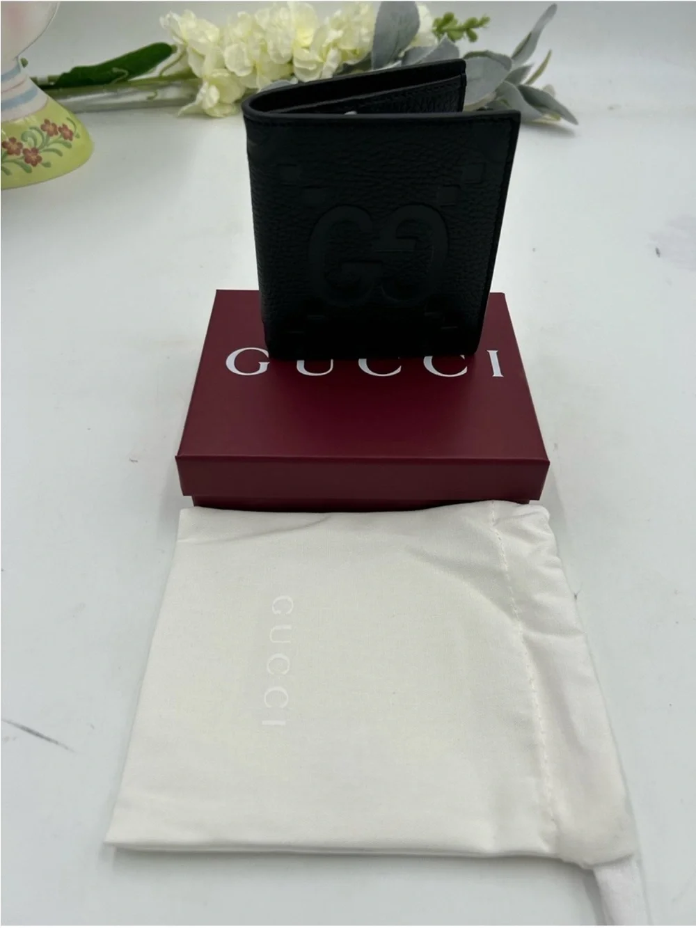 Men’s Gucci, jumbo GG leather bifold wallet made in Italy